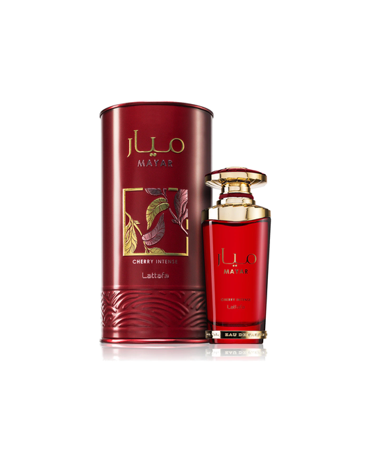 Profumo unisex Mayar Cherry Intense di Lattafa. Vista completa con elegante scatola cilindrica rosso rubino decorata con foglie d'oro e il flacone in vetro abbinato