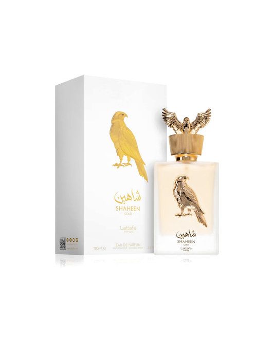 Profumo unisex Shaheen Gold Lattafa Pride. Vista completa con elegante scatola bianca e oro e flacone satinato sormontato dal tappo dorato a forma di falco
